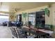 Covered patio with outdoor dining and living areas, ideal for relaxation at 8134 Bayshore Dr, Seminole, FL 33776