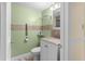 Clean bathroom with updated vanity and grab bars at 10449 Larchmont N Pl, Pinellas Park, FL 33782