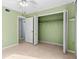 Bright bedroom with tile floors and spacious closet at 10449 Larchmont N Pl, Pinellas Park, FL 33782