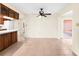 Bright dining room with tile floors, ceiling fan and view of kitchen at 10449 Larchmont N Pl, Pinellas Park, FL 33782