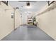 Attached garage with epoxy floor and additional storage at 10449 Larchmont N Pl, Pinellas Park, FL 33782