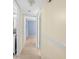 Bright hallway with neutral walls and tile flooring at 10449 Larchmont N Pl, Pinellas Park, FL 33782