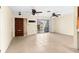 Bright living area with tile floors, ceiling fans, and sliding glass doors at 10449 Larchmont N Pl, Pinellas Park, FL 33782