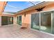 Bright covered patio with tile floor and access from multiple rooms at 10449 Larchmont N Pl, Pinellas Park, FL 33782