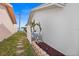 Landscaped side yard with cactus and stone pathway at 10449 Larchmont N Pl, Pinellas Park, FL 33782