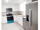 Modern kitchen with stainless steel appliances and granite countertops at 11300 Yellowwood Ln, Port Richey, FL 34668