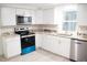 Modern kitchen featuring granite countertops and stainless steel appliances at 11300 Yellowwood Ln, Port Richey, FL 34668