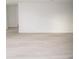 Spacious living room featuring new flooring and fresh paint at 11300 Yellowwood Ln, Port Richey, FL 34668
