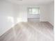 Large living room with neutral walls and new flooring at 11300 Yellowwood Ln, Port Richey, FL 34668