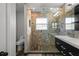 Modern bathroom with a glass-enclosed shower, sleek vanity, and stylish fixtures, offering a spa-like experience at 22847 Sonoma Ln, Lutz, FL 33549