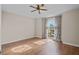 Bright bedroom featuring hardwood floors and a large window at 22847 Sonoma Ln, Lutz, FL 33549