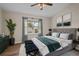 Spacious bedroom with hardwood floors, window and comfy seating at 22847 Sonoma Ln, Lutz, FL 33549