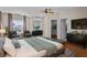 Primary bedroom with king-size bed and ensuite bathroom at 22847 Sonoma Ln, Lutz, FL 33549