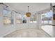 Bright breakfast nook featuring multiple windows and a stylish pendant light at 22847 Sonoma Ln, Lutz, FL 33549