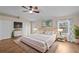 Bright main bedroom with a king-size bed and plenty of natural light at 22847 Sonoma Ln, Lutz, FL 33549