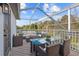 Relaxing screened-in patio with comfortable wicker furniture and a glass-top dining table overlooking lush scenery at 22847 Sonoma Ln, Lutz, FL 33549