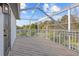 Spacious screened balcony with wooden deck and scenic view at 22847 Sonoma Ln, Lutz, FL 33549