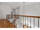 Upper hallway showcasing a chandelier and wood flooring at 22847 Sonoma Ln, Lutz, FL 33549