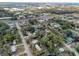 Aerial view of a neighborhood showcasing mobile homes and trees at 4110 Wedgemere Dr, Tampa, FL 33610