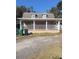 House exterior featuring a covered porch and attractive landscaping at 4616 River Hills Dr, Tampa, FL 33617