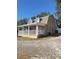 Side view of charming house with covered porch at 4616 River Hills Dr, Tampa, FL 33617