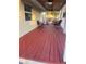 Spacious red porch with seating area, ceiling fan and white railings at 4616 River Hills Dr, Tampa, FL 33617