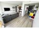 Bright living room with gray sofa and open concept at 470 3Rd S St # 405, St Petersburg, FL 33701