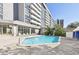 Refreshing community pool with lounge chairs and a surrounding patio at 470 3Rd S St # 405, St Petersburg, FL 33701