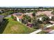 Single-story home with solar panels and lakefront location at 4817 Sandy Glen Way, Wimauma, FL 33598