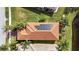Aerial view showcasing home's roofline and solar panels at 4817 Sandy Glen Way, Wimauma, FL 33598