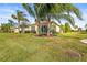 Landscaped backyard with a view of neighboring homes at 4817 Sandy Glen Way, Wimauma, FL 33598