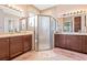 Double vanity bathroom with a large walk-in shower at 4817 Sandy Glen Way, Wimauma, FL 33598