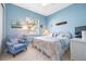 Serene bedroom with a king-size bed and light blue walls at 4817 Sandy Glen Way, Wimauma, FL 33598