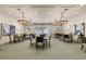 Bright dining room with tables and chairs at 4817 Sandy Glen Way, Wimauma, FL 33598