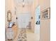 Elegant entryway with a decorative console table and access to other rooms at 4817 Sandy Glen Way, Wimauma, FL 33598