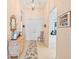 Bright foyer showcasing a decorative mirror, chandelier, and neutral color palette at 4817 Sandy Glen Way, Wimauma, FL 33598