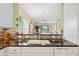 View from the kitchen featuring countertop and a glimpse into the living room at 4817 Sandy Glen Way, Wimauma, FL 33598