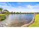 Stunning lakefront view of a tranquil community at 4817 Sandy Glen Way, Wimauma, FL 33598