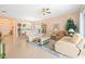 Spacious living room with light beige walls and comfortable seating at 4817 Sandy Glen Way, Wimauma, FL 33598