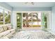 Bright sunroom with water views and comfortable seating, perfect for relaxation at 4817 Sandy Glen Way, Wimauma, FL 33598