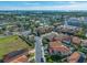 Aerial view of neighborhood, showcasing homes and landscape at 4943 Grand Oak Cir, Madeira Beach, FL 33708