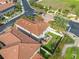 Aerial view showcasing a house with a backyard patio at 4943 Grand Oak Cir, Madeira Beach, FL 33708