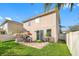 Private backyard oasis with patio and grassy area at 4943 Grand Oak Cir, Madeira Beach, FL 33708