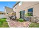 Lush backyard with patio, grass, and a dining set at 4943 Grand Oak Cir, Madeira Beach, FL 33708