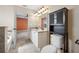 Bathroom featuring double sink vanity, granite countertops, decorative lighting, and tiled floors at 4943 Grand Oak Cir, Madeira Beach, FL 33708