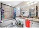 bathroom with tub, shower, and granite vanity at 4943 Grand Oak Cir, Madeira Beach, FL 33708