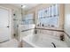 Relaxing bathroom with soaking tub and shower at 4943 Grand Oak Cir, Madeira Beach, FL 33708