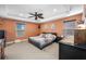 Spacious bedroom with ceiling fan and large bed at 4943 Grand Oak Cir, Madeira Beach, FL 33708