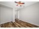 This bedroom features wood-look flooring and a ceiling fan at 4943 Grand Oak Cir, Madeira Beach, FL 33708