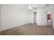 Neutral bedroom with carpet, closet and access to the hallway at 4943 Grand Oak Cir, Madeira Beach, FL 33708